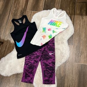 2 Nike tank tops and 1 Nike capri.